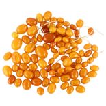 A quantity of loose butterscotch amber beads, ranging from 26.1mm - 12.1mm, 152g total Lot sold as