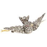 A late Victorian ruby and diamond swallow bird brooch, 3-dimensionally formed and pave set with