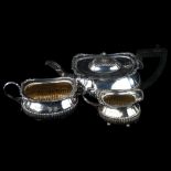 A late Victorian silver 3-piece tea set, comprising teapot, 2-handled sugar bowl and cream jug, oval