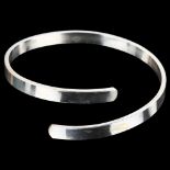 A handmade silver torque bangle, by C Wilkes, band width 6.1mm, internal circumference 19cm, 29.3g