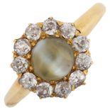 An Antique 18ct gold cat's eye chrysoberyl and diamond cluster ring, set with round cabochon