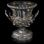 A fine quality Victorian silver pedestal wine cooler, circular form with high relief embossed