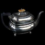 A George III silver teapot, oval bulbous form with ivory knop and bun feet, by Alice and George