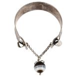 DORNER - a Continental silver and banded agate torque bracelet, band width 23.5mm, internal