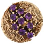 A 1970s 9ct gold amethyst abstract ring, set with round-cut amethysts and folded textured shoulders,