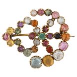 An Antique gem set crest brooch, unmarked yellow metal settings with gemstones including ruby
