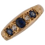 An early 20th century 18ct gold graduated five stone sapphire and diamond half hoop ring, set with