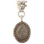 A Victorian Aesthetic Movement photo locket pendant necklace, unmarked silver relief embossed and