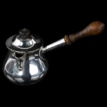 A George III silver Brandy pan, circular baluster form with side pouring turned wood handle and