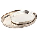 A graduated pair of silver plated tea trays, largest length 63cm (2) Lot sold as seen unless