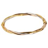 A modern 9ct three-colour gold rope twist hinged bangle, maker's marks IBB, band width 4.6mm,