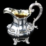 A William IV silver pumpkin cream jug, baluster form with acanthus handle and gilt interior, by