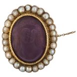 An Antique amethyst glass and pearl cluster cameo brooch, depicting female bust, in unmarked gold