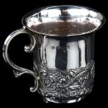 An Edwardian silver christening mug, half relief embossed foliate decoration, by William Hutton &