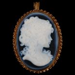 A late 20th century hardstone cameo brooch/pendant, depicting female profile, in 9ct gold rope twist