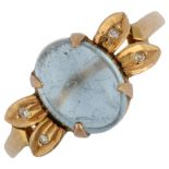An aquamarine and diamond dress ring, unmarked gold settings with oval cabochon aquamarine and