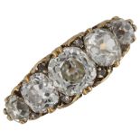 An Antique 18ct gold graduated five stone diamond half hoop ring, set with old cushion-cut