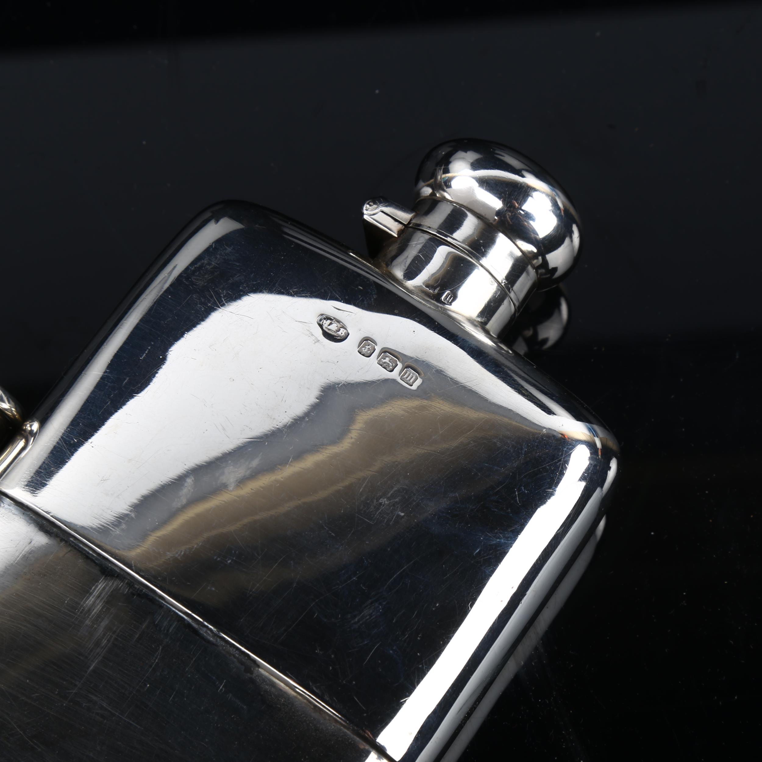 A George V curved silver spirit flask, with screw-lock button cap and removeable beaker with gilt - Image 3 of 3