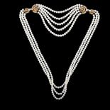 BOUCHERON - an 18ct gold multi-strand pearl and diamond necklace, the graduated pearls ranging