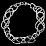 A handmade silver interwoven chain bracelet, by C Wilkes, length 18cm, 28.7g No damage or repairs,