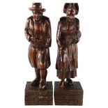 A pair of 19th century carved and stained wood figures, height 44cm Good condition