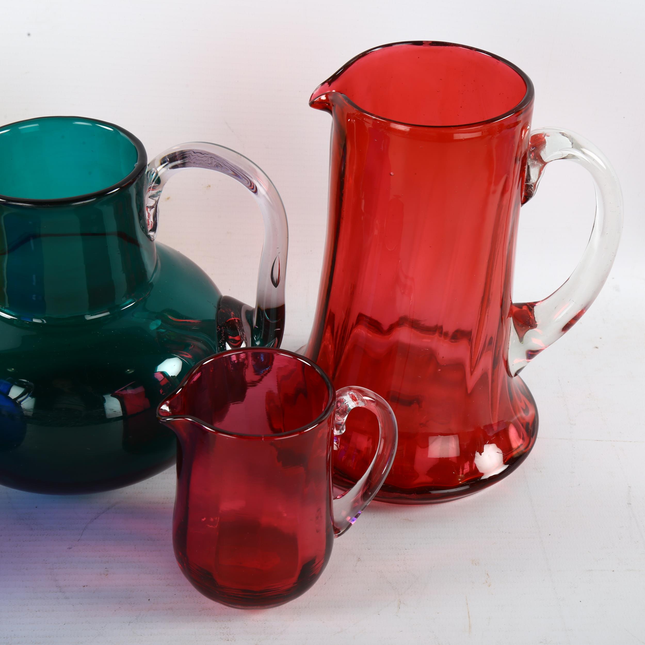 A group of 19th century coloured glassware, largest jug height 18cm (5) Amber coloured glass jug has - Image 3 of 3