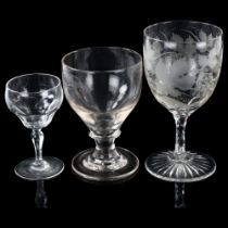 A 19th century wine glass with engraved grapevine bowl, height 17cm, and 2 other Antique glasses (3)