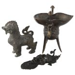 A Chinese relief cast bronze lamp on 3 feet, height 16cm, a Chinese bronze Dog of Fo, and an African
