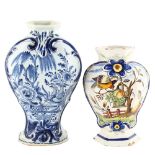 An 18th century Delft blue and white pottery vase, height 27cm, and a tin glazed faience pottery