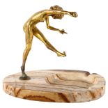 An Art Nouveau gilt-bronze erotic figure of a girl juggling, unsigned, on banded onyx base, height