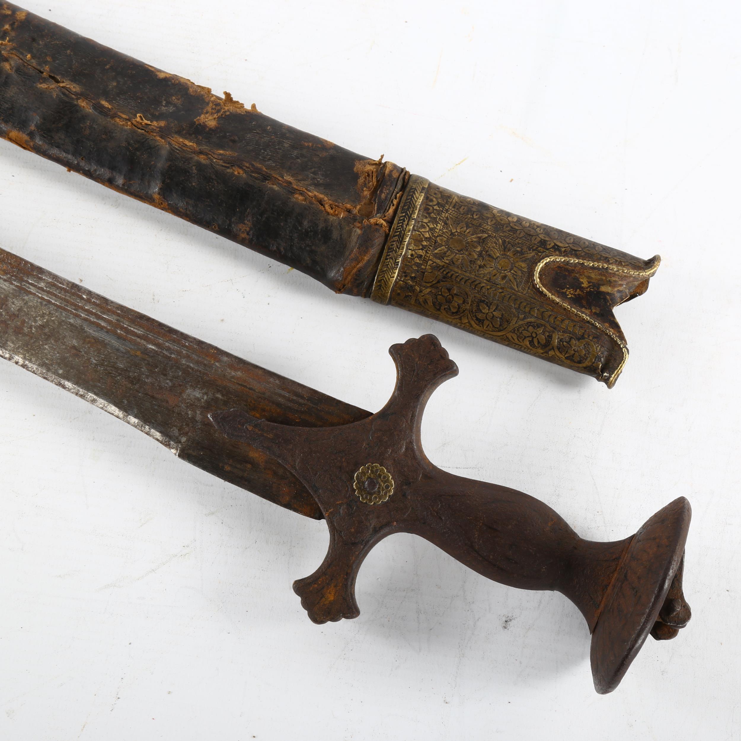 An 18th/19th century Indian Talwar in leather bound wooden scabbard, length 97cm Hilt rocks slightly - Image 2 of 3