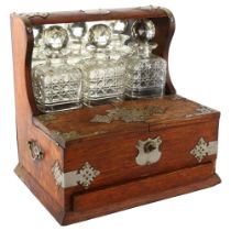 An Edwardian 3 decanter oak tantalus, Gothic metal mounts, with glass cabinet, cribbage board drawer