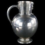 A 19th century Aesthetic Period ale jug by Martin Hall & Co, with mask spout and armorial crest,
