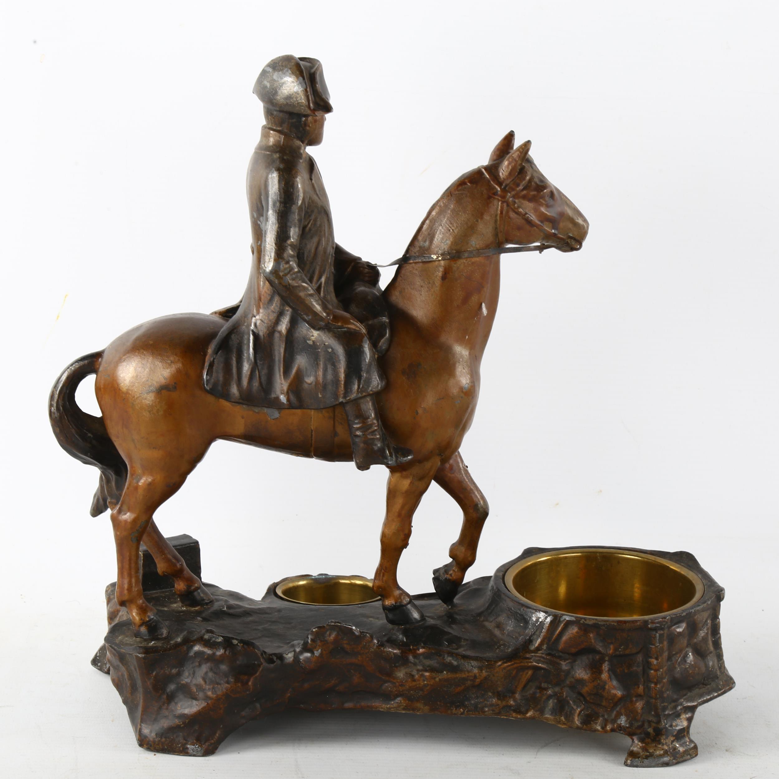 A 19th century patinated metal smoker's stand, surmounted by a figure of Napoleon on horseback, - Image 3 of 3