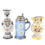 A faience tin glazed jug, height 17cm, a Continental faience pottery vase, height 25cm, and a blue
