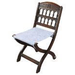 A late Victorian Aesthetic movement folding oak chair by Bruce J Talbert, height 78cm Good