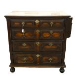 A Jacobean oak chest of 4 long drawers on bun feet. 100 x 100 x 59cm.