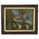 A carved and painted wood/wax relief picture, depicting trees and cherubs in glazed frame, 21cm x