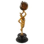 A 19th century novelty clock, supported by gilt-metal figure, height 27cm Gilding on figure is