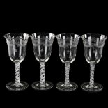 A set of 4 wine glasses with engraved bowls and opaque milk twist stems, height 19.5cm All in