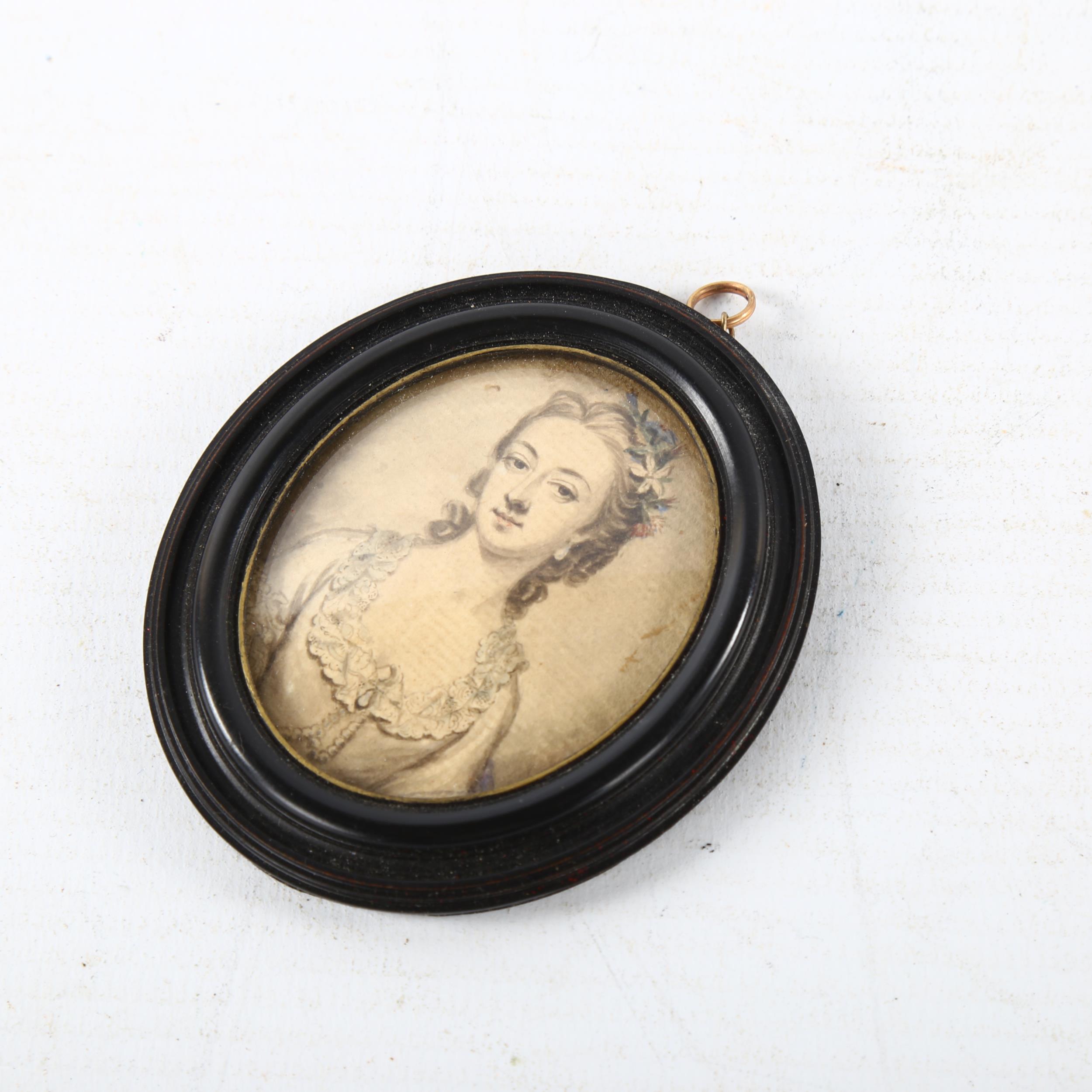 An 18th century miniature watercolour on paper, half length portrait of a lady, unsigned in - Image 2 of 3