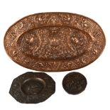 An oval copper armorial plaque, length 52cm, and 2 relief cast bronze plaques (3)