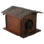 A stained wood cigar box in the form of a dog kennel, with patinated metal dog and brass strapwork