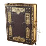 A Victorian gilded leather-bound photograph album, with musical movement, 30cm x 23cm Musical