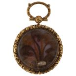 A 19th century memorial locket pendant, unmarked yellow metal settings, with a split pearl and