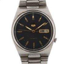 SEIKO 5 - a stainless steel automatic bracelet watch, ref. 7009-3130, space grey dial with gilt