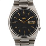 SEIKO 5 - a stainless steel automatic bracelet watch, ref. 7009-3130, space grey dial with gilt