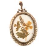 A 19th century 9ct rose gold double-sided locket pendant, relief embossed foliate decoration,