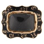 A 19th century black enamel memorial brooch, unmarked gold closed-back settings with vacant