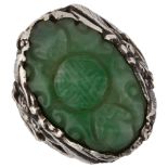 A Chinese Arts and Crafts silver and jade Good Luck ring, with relief carved bat and seal motif,